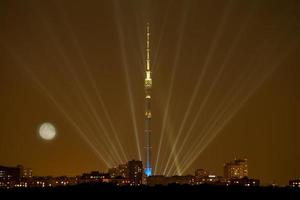 full moon over illuminated Moscow city photo