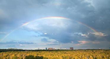 rainbow under autumn urban park photo