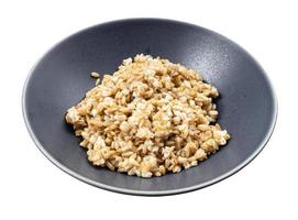 cooked porridge from whole-grain oat in gray bowl photo