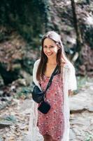 Attractive woman is walking in park posing on camera. photo