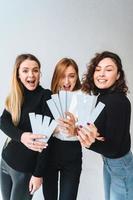 Three beautiful young girls posing for the camera photo