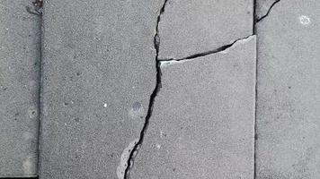 Cracked brick ground broken on street road from earthquake or not standard video