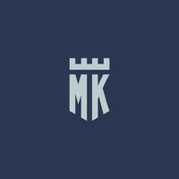 Monograma del logotipo de mk con castillo de fortaleza y diseño de estilo de escudo vector