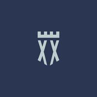 XX logo monogram with fortress castle and shield style design vector