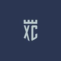 monograma del logotipo xc con castillo de fortaleza y diseño de estilo escudo vector