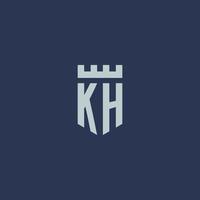 monograma del logotipo kh con castillo de fortaleza y diseño de estilo escudo vector