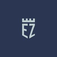 monograma del logotipo ez con castillo de fortaleza y diseño de estilo escudo vector