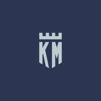 monograma del logotipo de km con castillo de fortaleza y diseño de estilo escudo vector