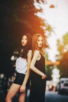 pretty girls posing in a city street photo