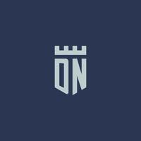 DN logo monogram with fortress castle and shield style design vector