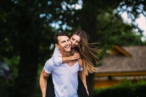 Young adult brunette man and woman in the park photo