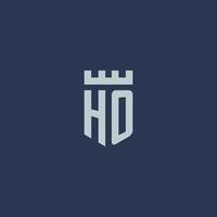 HO logo monogram with fortress castle and shield style design vector