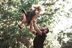 Dad and little daughter have fun and playing photo