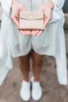 Woman hands hold purse photo