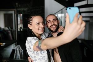 man and woman making selfie photo