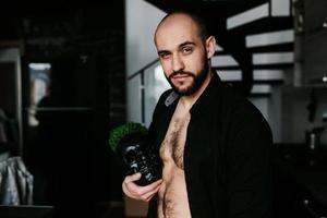 bearded man holding skull photo