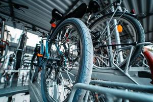 Many bicycle in a row. Bicycle parking at the street photo