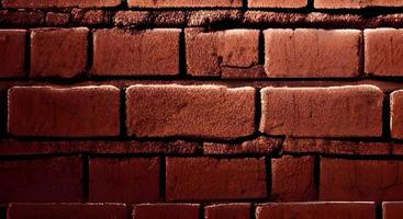 Brown brick wall texture grunge background with vignetted corners, may use to interior design photo