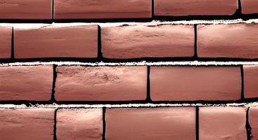 Red brick wall with contrasty sunlight photo