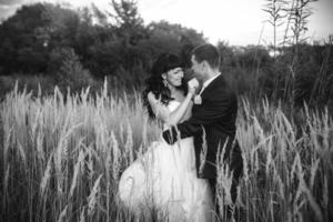 Lovely couple spends time in the field photo