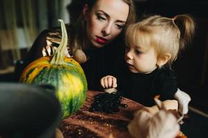 mother and daughter playing together at home photo