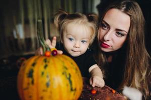 mother and daughter playing together at home photo