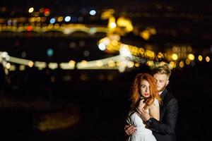 Lovely bride and groom on a background of Budapest photo