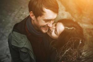 Charming couple in a dress walking down the street photo