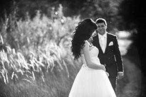 Lovely couple spends time in the field photo