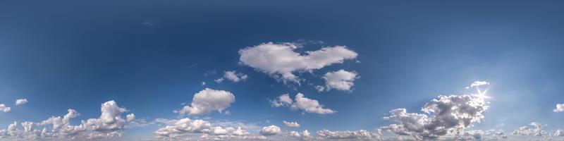 blue sky hdri 360 panorama with white beautiful clouds in seamless projection with zenith for use in 3d graphics or game development as sky dome or edit drone shot for sky replacement photo