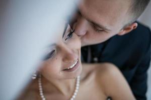 Beautiful European bridal couple in the hotel room photo