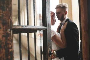 Groom and gorgeous brine in hotel room photo