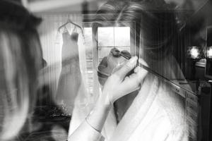 Applying make up to bride photo