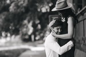 man and woman embracing each other photo