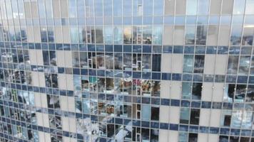 Aerial view of mirror window exterior of modern skyscraper in Kyiv on a winter day video