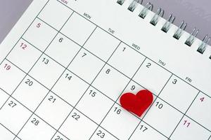 Red heart shape on the date of the 9th day in the calendar. photo