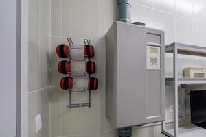 rows of empty pneumatic tubes of transfer system station in modern clinic, designed for fast operational transfer of analyzes, drugs and documents through air tunnels photo