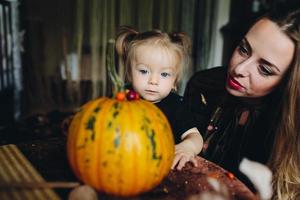 mother and daughter playing together at home photo