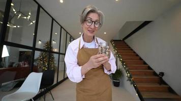 Woman proudly shows dry ingredients in jars video