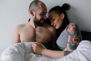 man and woman on the bed photo