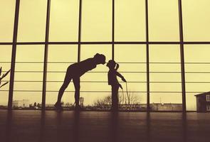 Silhouette of mother and daughter in the gym photo