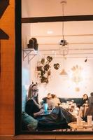 Woman works at a cafe in the evening photo