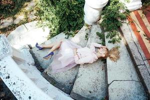 Girl is posing on the stone steps photo