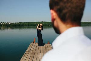 couple spends time on the wooden pier photo