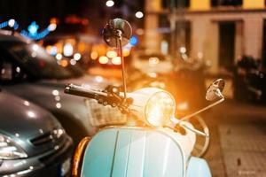 Light blue retro scooter on the street photo