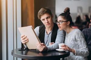 Guy and girl at a meeting in a cafe photo