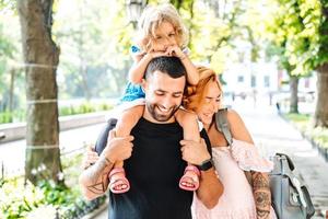 dad mom little girl in the park photo