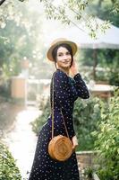 Girl in hat posing on camera photo