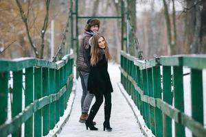 beautiful couple on a bridge photo