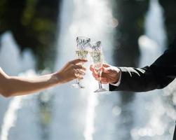 Cheers of bride and groom photo